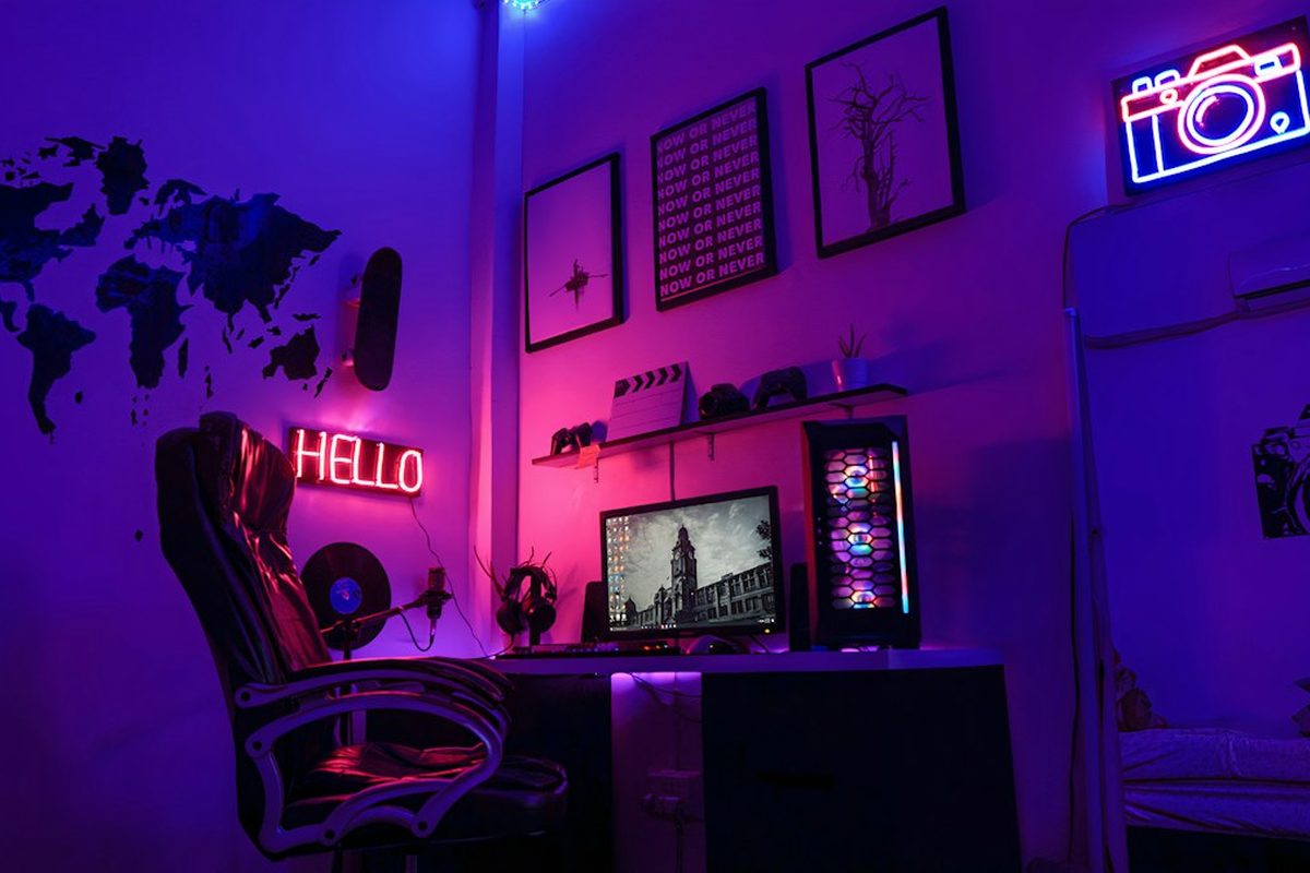 Gaming room with pink and purple neon lights