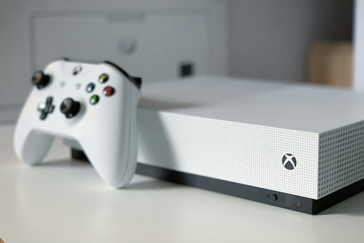 White Xbox console with matching controller